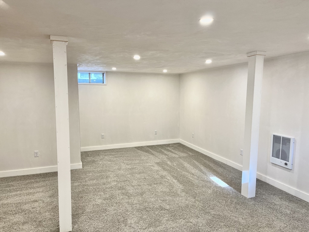127 Old Millville Road Uxbridge, MA 01569 - Photo 24 of 30 an empty room with a empty space and windows