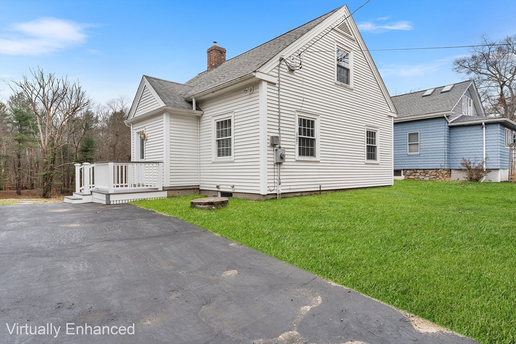 127 Old Millville Road Uxbridge, MA 01569 - Photo 3 of 30 a view of a house with a yard and a garage