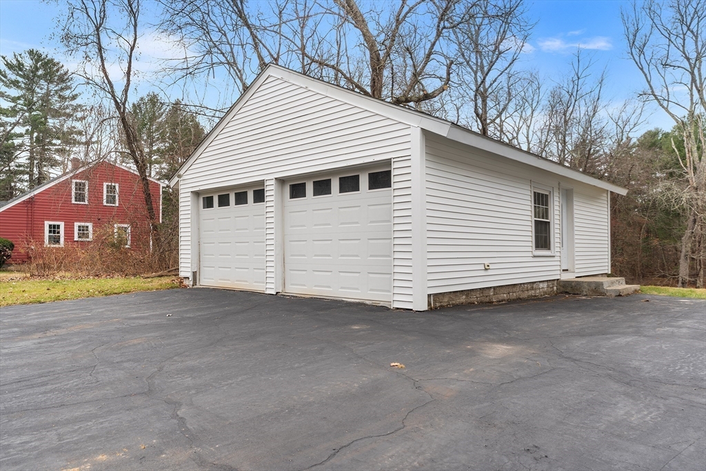 127 Old Millville Road Uxbridge, MA 01569 - Photo 4 of 30 a view of a house with a yard and garage