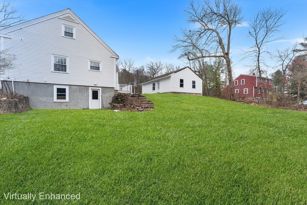 127 Old Millville Road Uxbridge, MA 01569 - Photo 5 of 30 a view of house with yard and green space