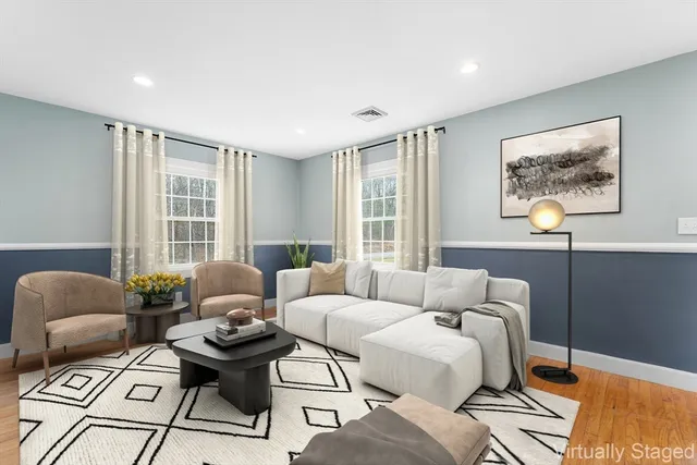 a living room with furniture and a window