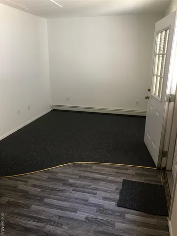 a view of wooden floor in an empty room