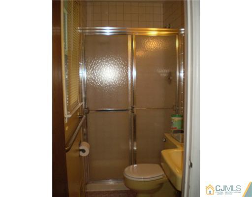 37 Glen Gary Road Middlesex, NJ 08846 - Photo 12 of 15 a bathroom with a shower a toilet and a sink