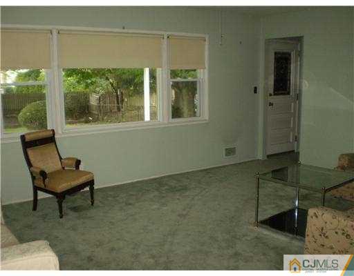 37 Glen Gary Road Middlesex, NJ 08846 - Photo 4 of 15 a living room with furniture and a window