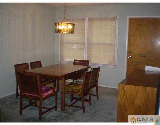 37 Glen Gary Road Middlesex, NJ 08846 - Photo 5 of 15 a view of a dining room with furniture and a chandelier