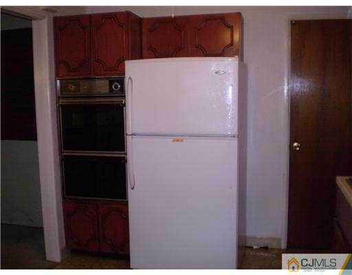 37 Glen Gary Road Middlesex, NJ 08846 - Photo 7 of 15 a white refrigerator freezer sitting inside of a kitchen