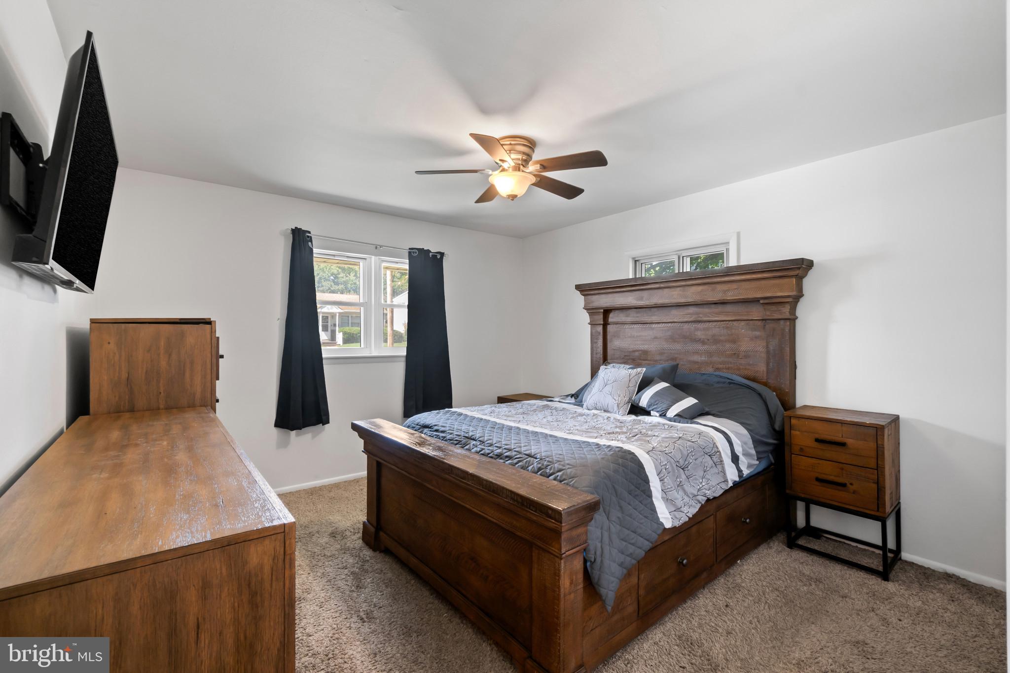 415 Baylor Road Glen Burnie, MD 21061 - Photo 11 of 29 a bedroom with a bed and a chandelier