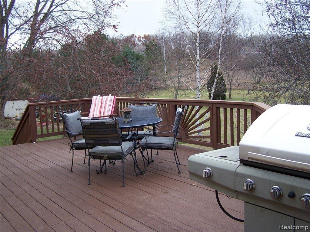 1294 Peavy Road Howell, MI 48843 - Photo 22 of 28 BEAUTIFUL DECK FOR ENTERTAINING