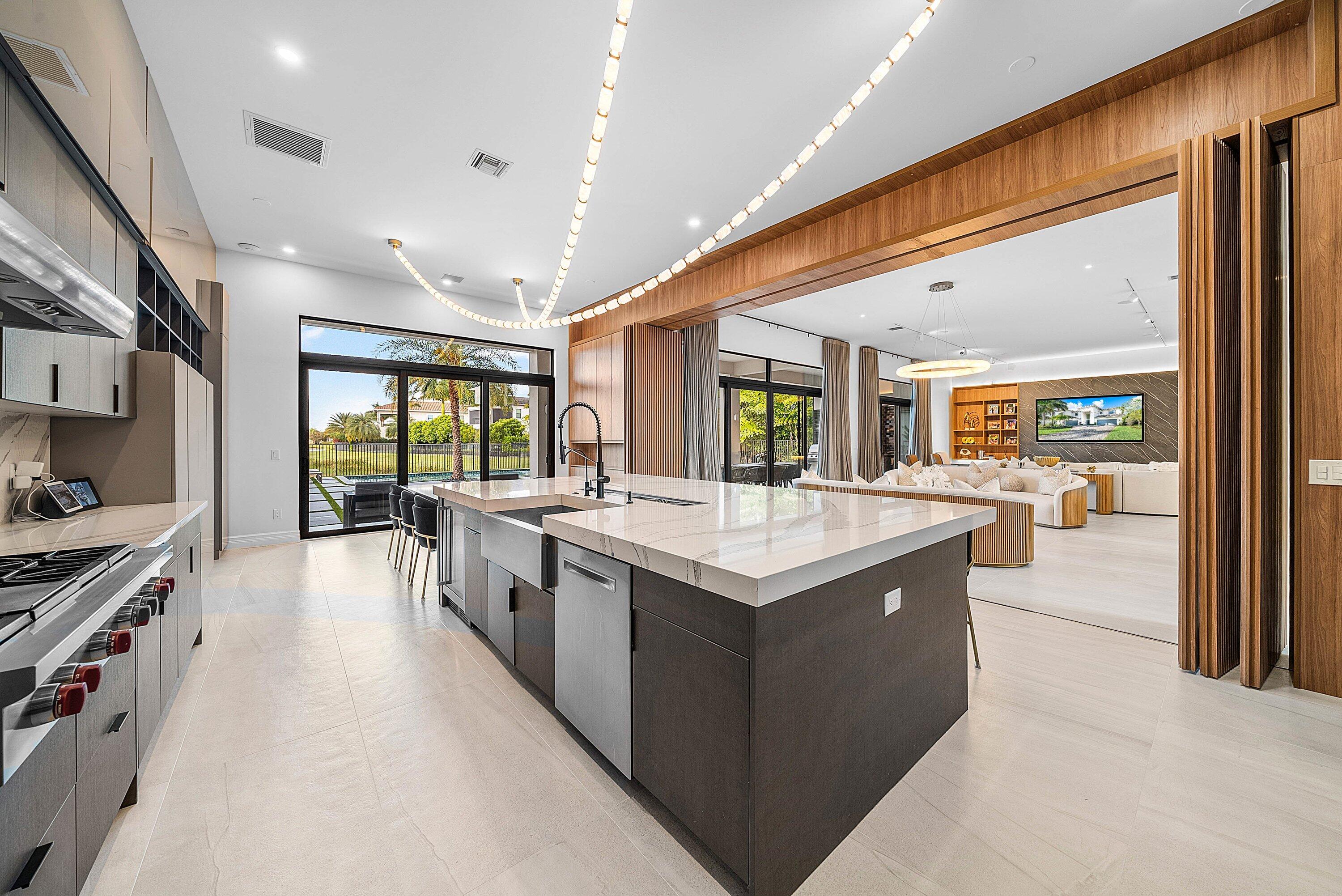 17353 Rosella Road Boca Raton, FL 33496 - Photo 15 of 77 a large kitchen with stainless steel appliances granite countertop a large center island and a sink