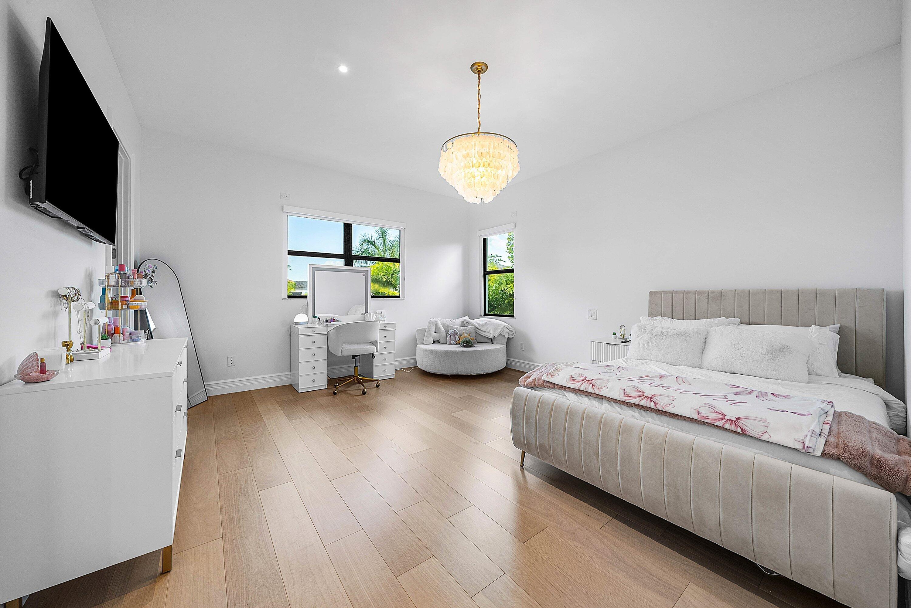 17353 Rosella Road Boca Raton, FL 33496 - Photo 25 of 77 a bedroom with bed and a flat tv screen on dresser