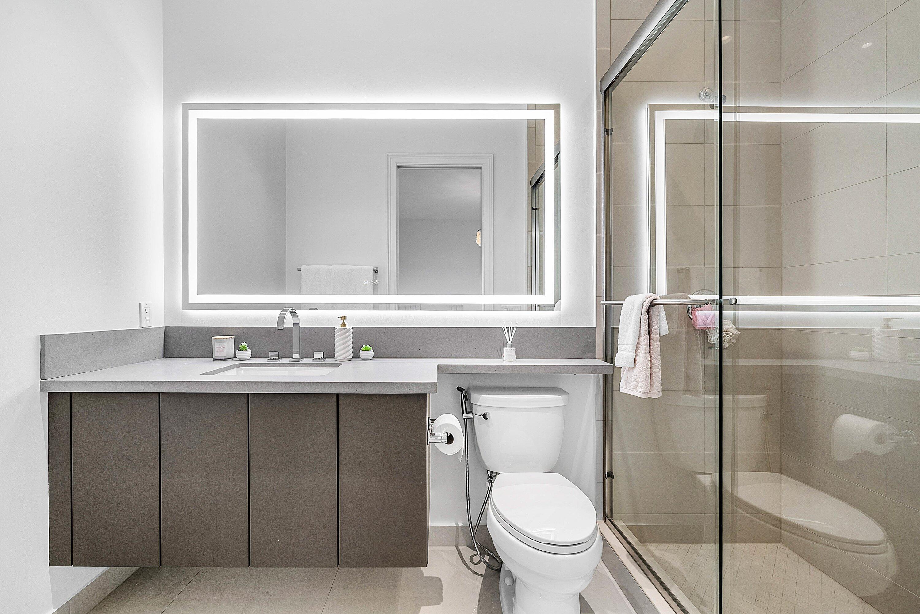17353 Rosella Road Boca Raton, FL 33496 - Photo 26 of 77 a bathroom with a toilet sink vanity and granite