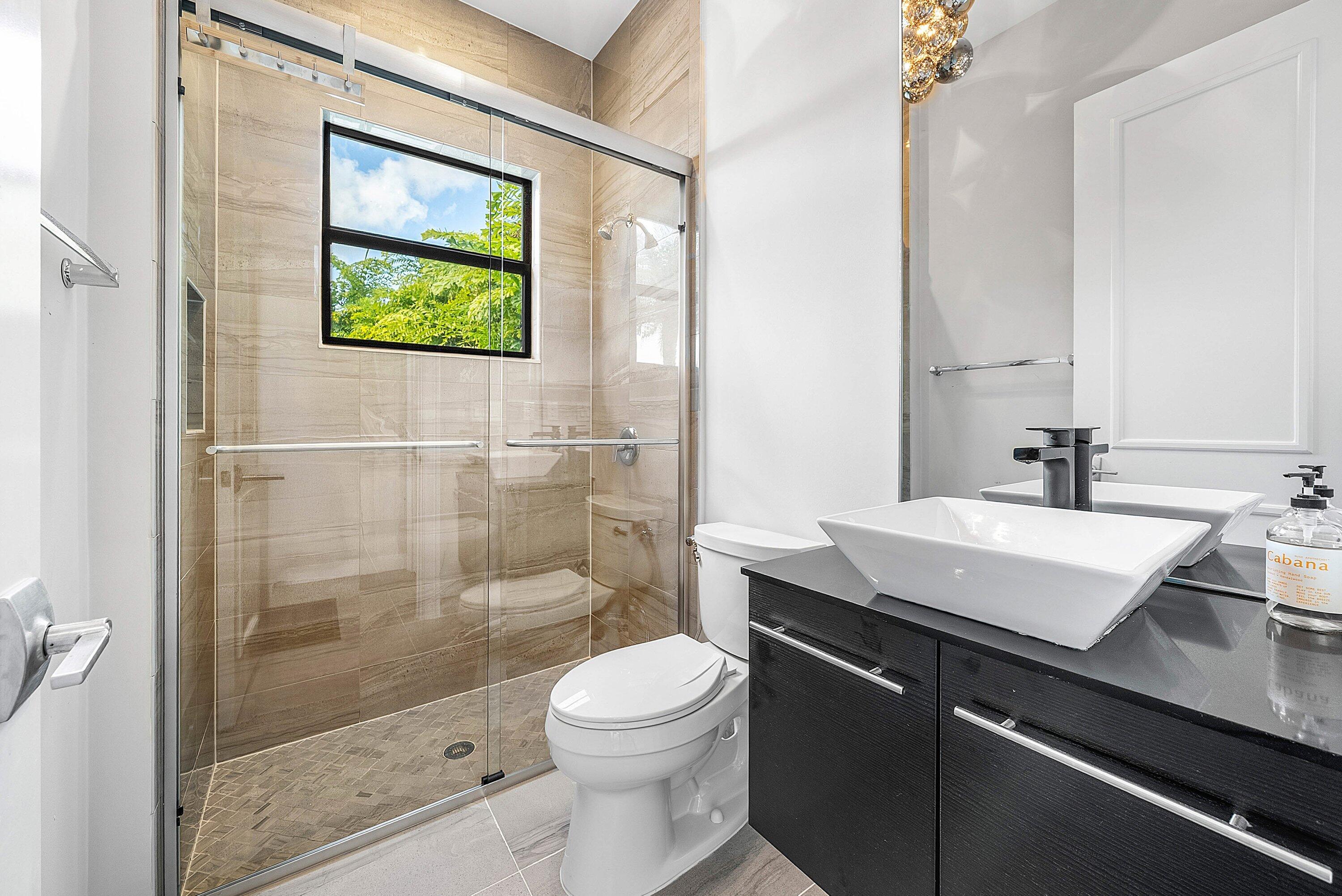 17353 Rosella Road Boca Raton, FL 33496 - Photo 31 of 77 a bathroom with a sink a toilet and shower