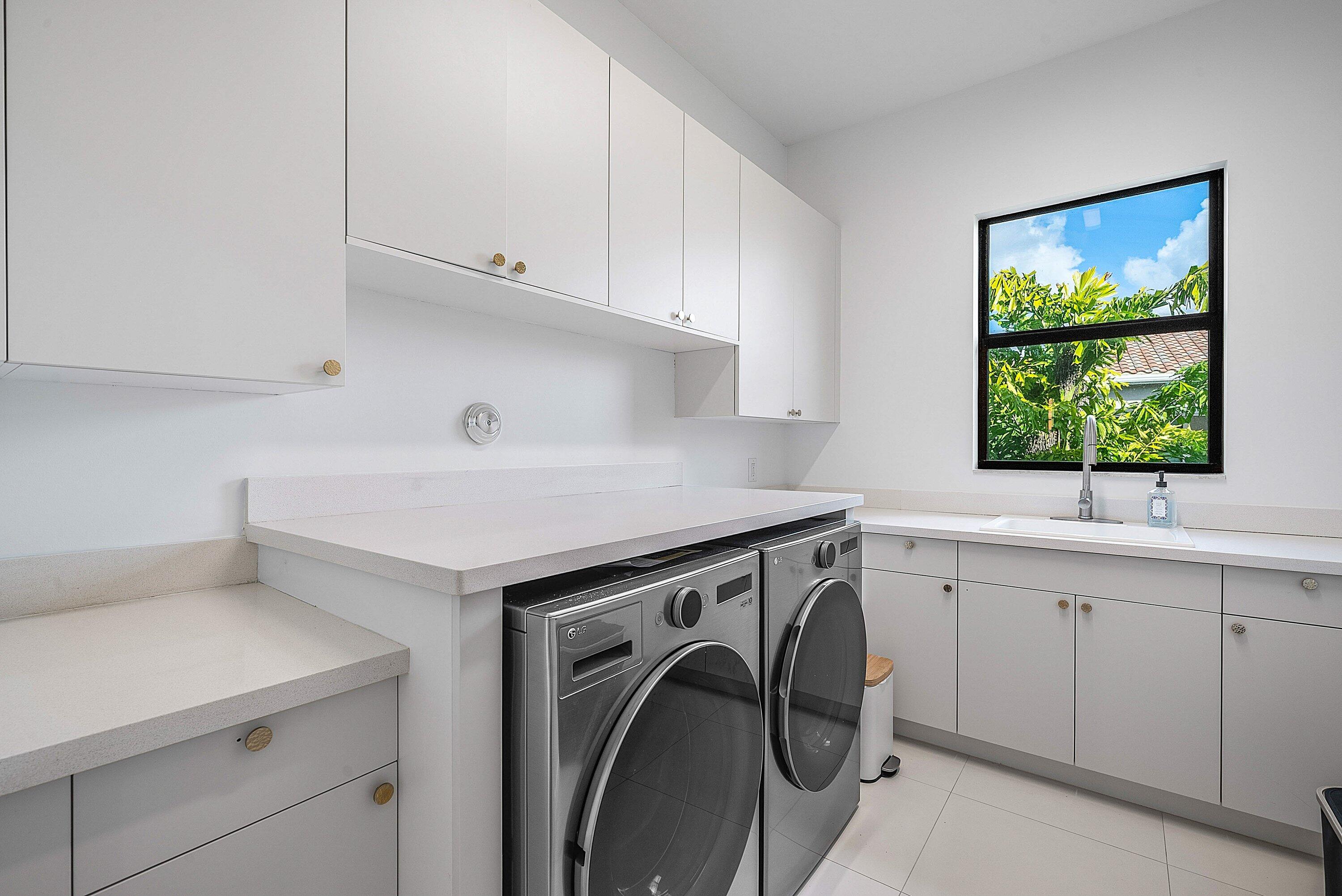 17353 Rosella Road Boca Raton, FL 33496 - Photo 32 of 77 a utility room with sink dryer and washer