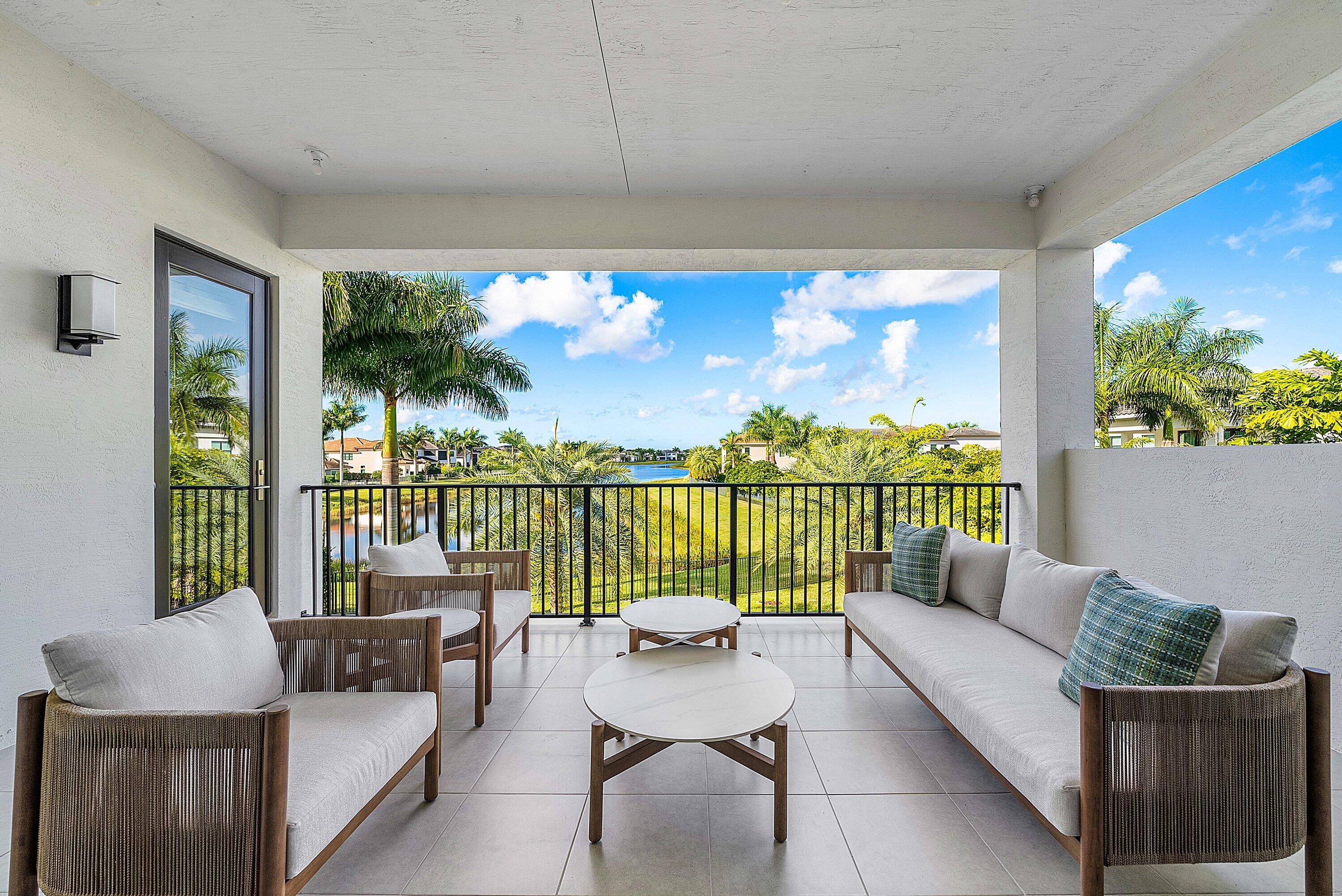 17353 Rosella Road Boca Raton, FL 33496 - Photo 35 of 77 a balcony with furniture and a potted plant