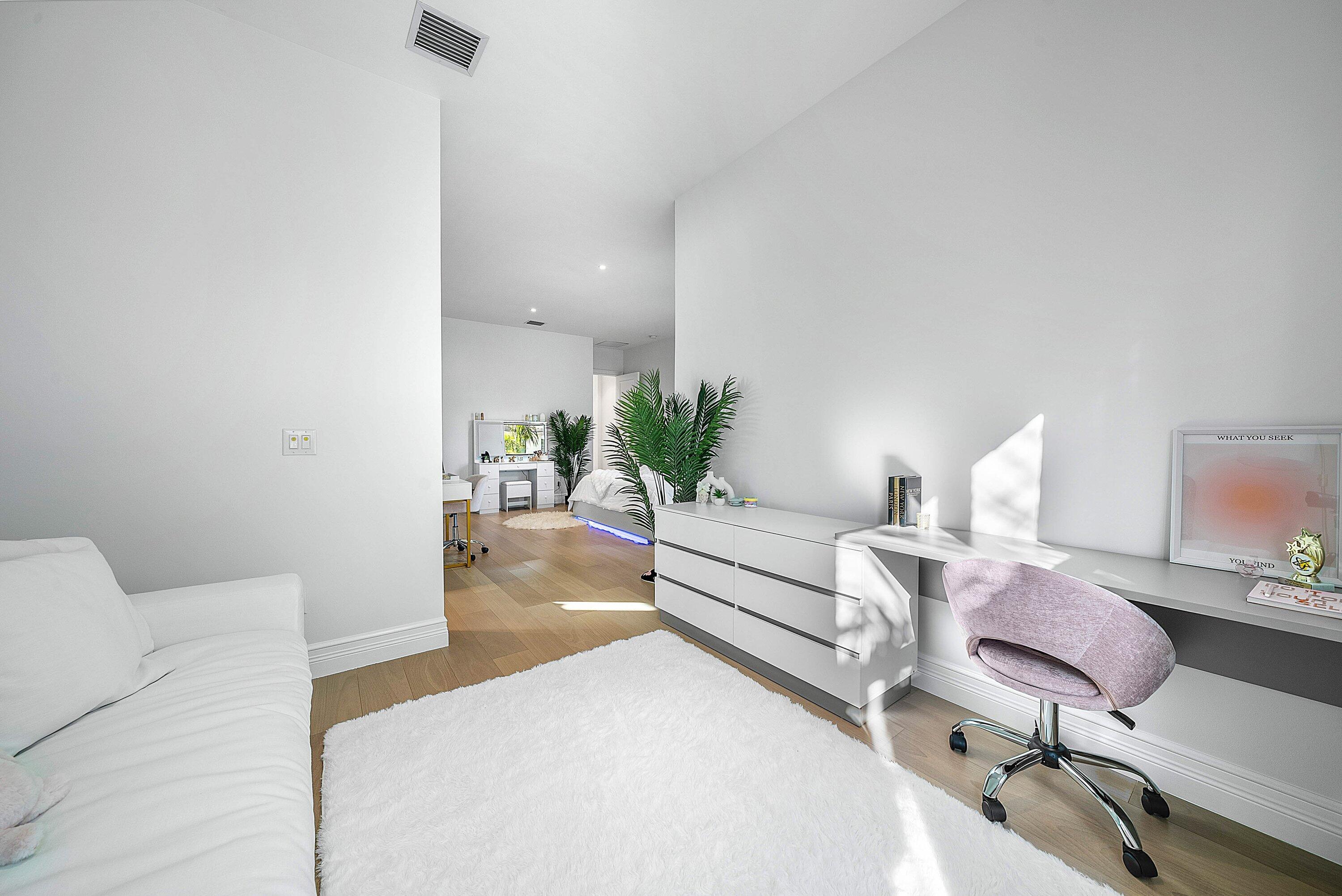 17353 Rosella Road Boca Raton, FL 33496 - Photo 37 of 77 a living room with furniture and a potted plant