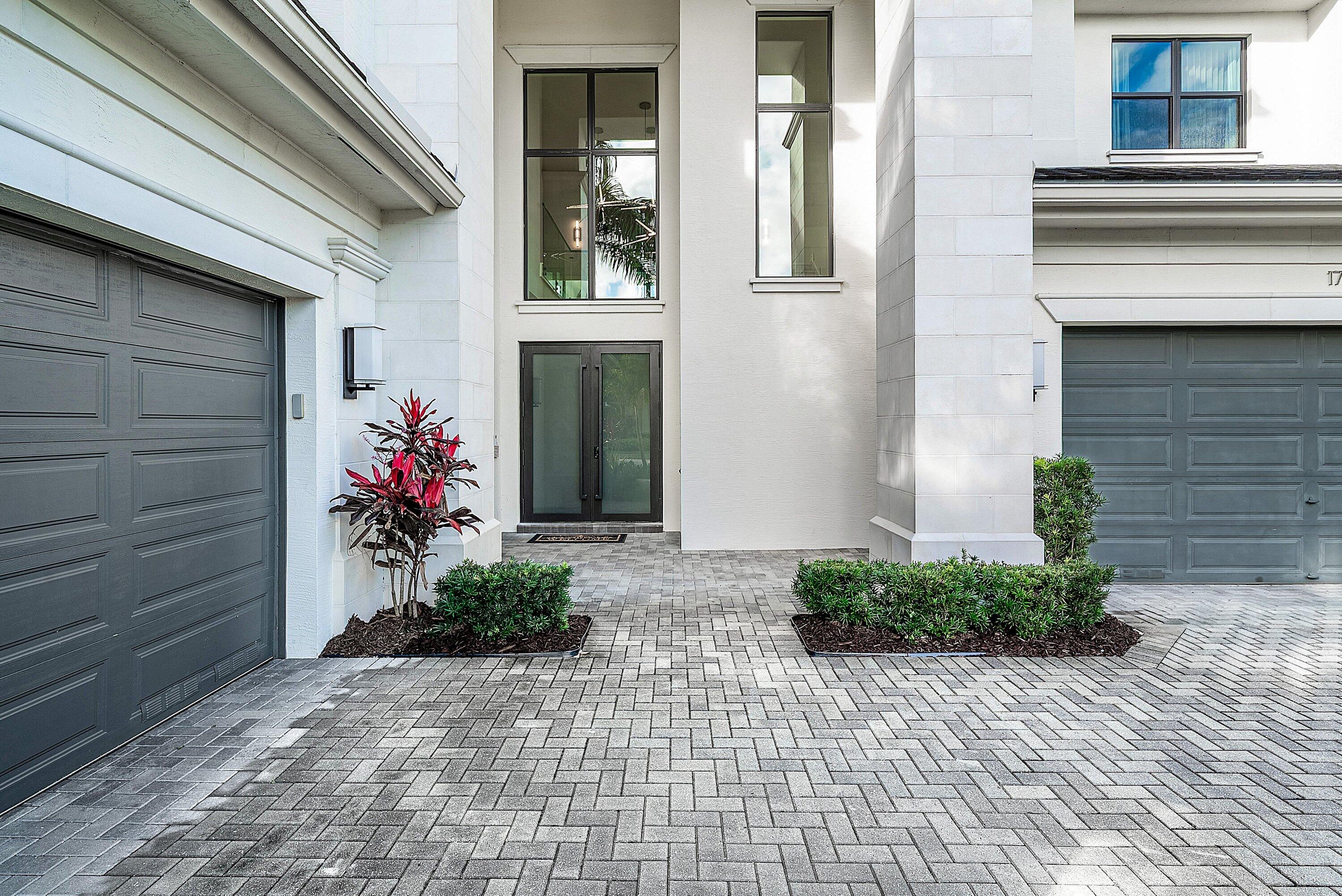 17353 Rosella Road Boca Raton, FL 33496 - Photo 4 of 77 a front view of a house with a yard
