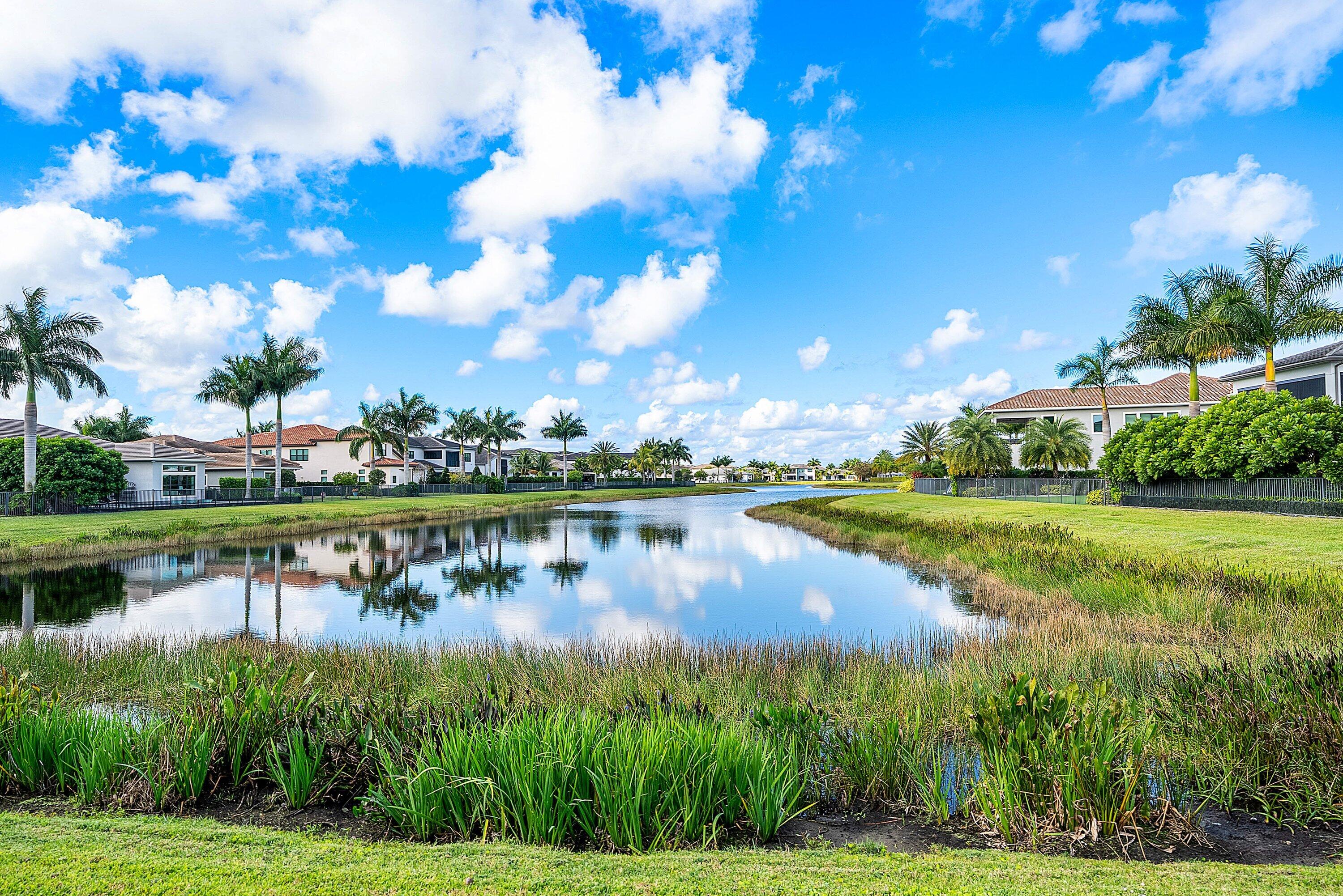 17353 Rosella Road Boca Raton, FL 33496 - Photo 55 of 77 a view of a lake with houses in the background