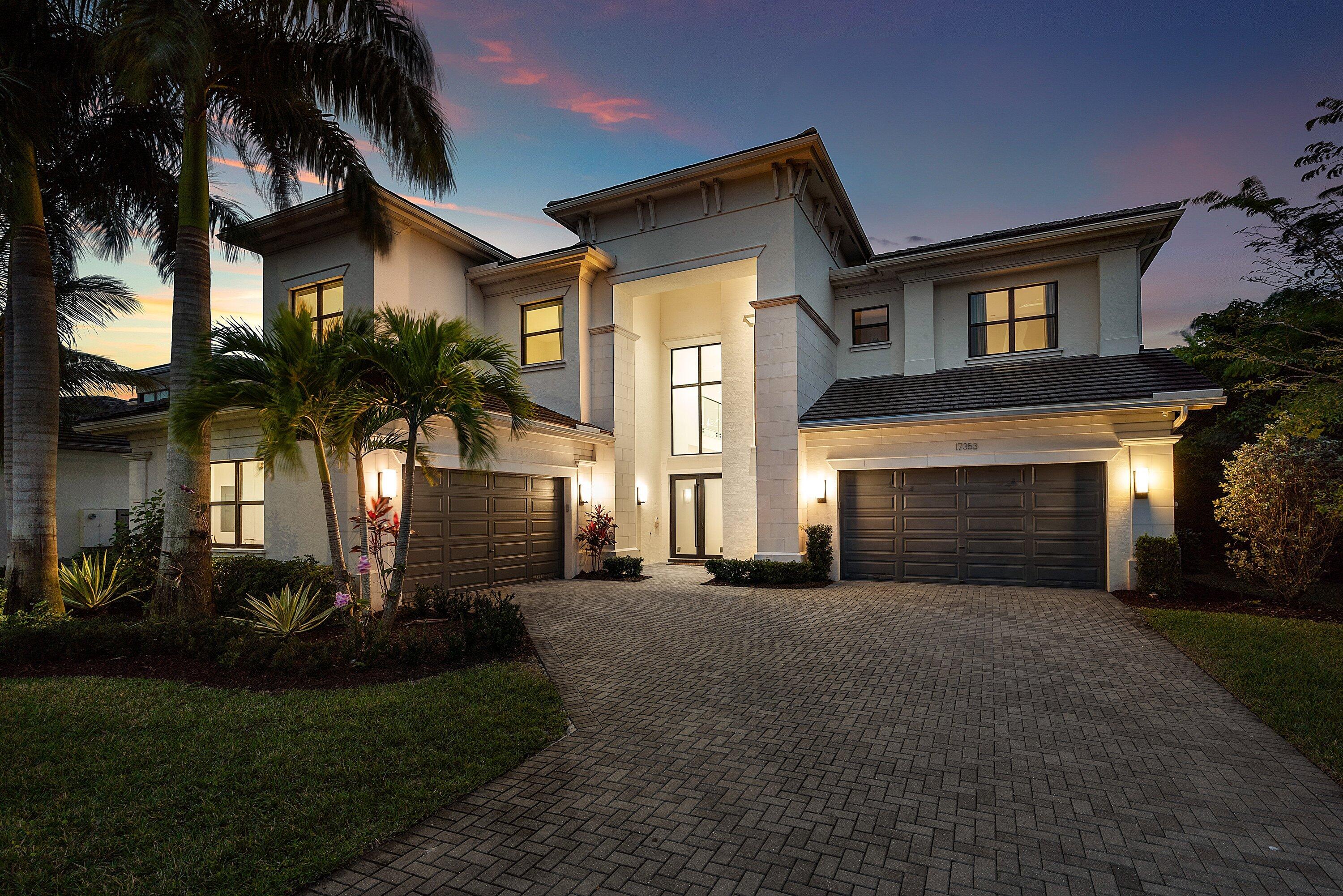 17353 Rosella Road Boca Raton, FL 33496 - Photo 59 of 77 a front view of a house with a garden and trees