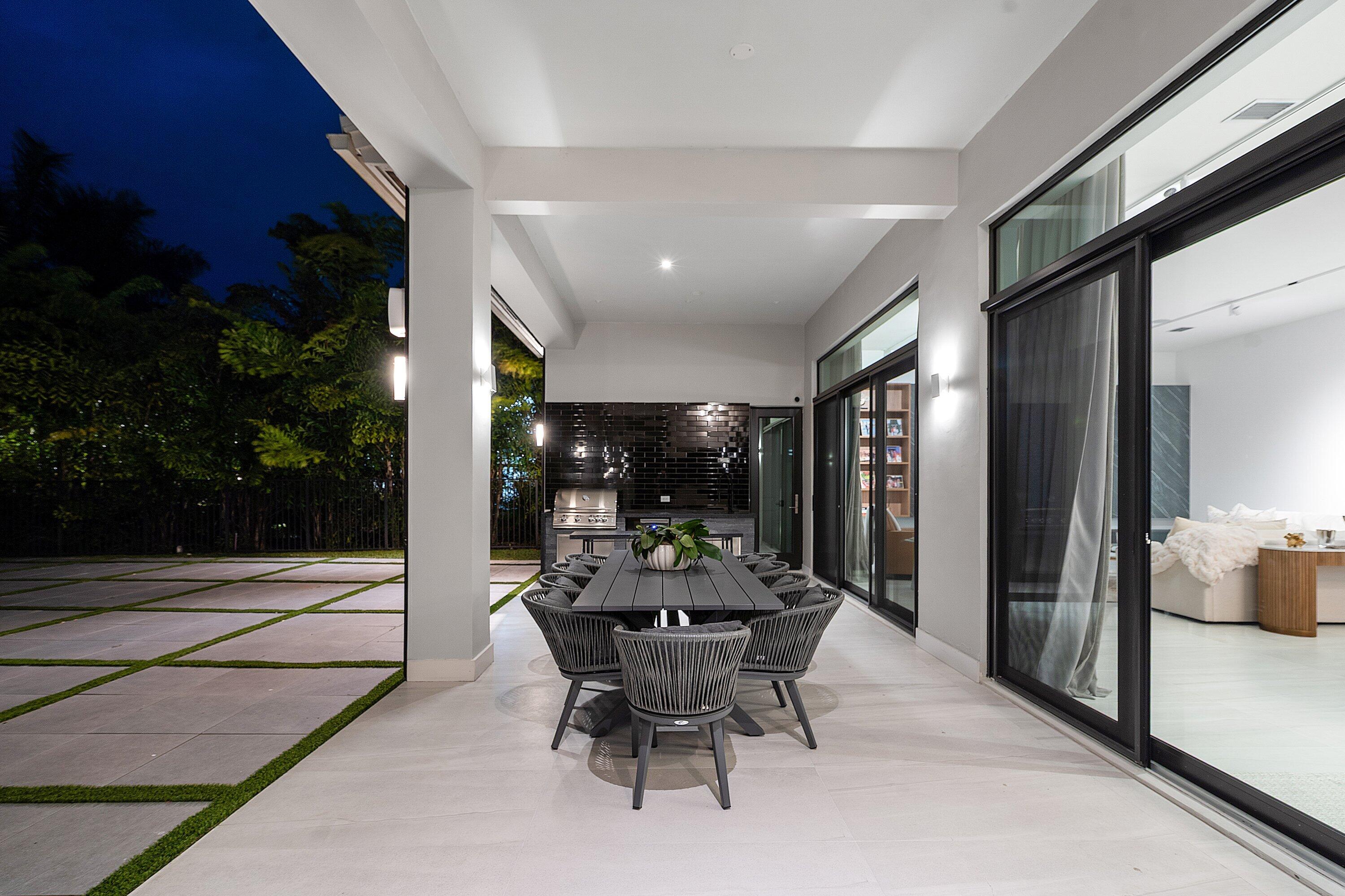 17353 Rosella Road Boca Raton, FL 33496 - Photo 64 of 77 a view of a dining room with furniture and chandelier