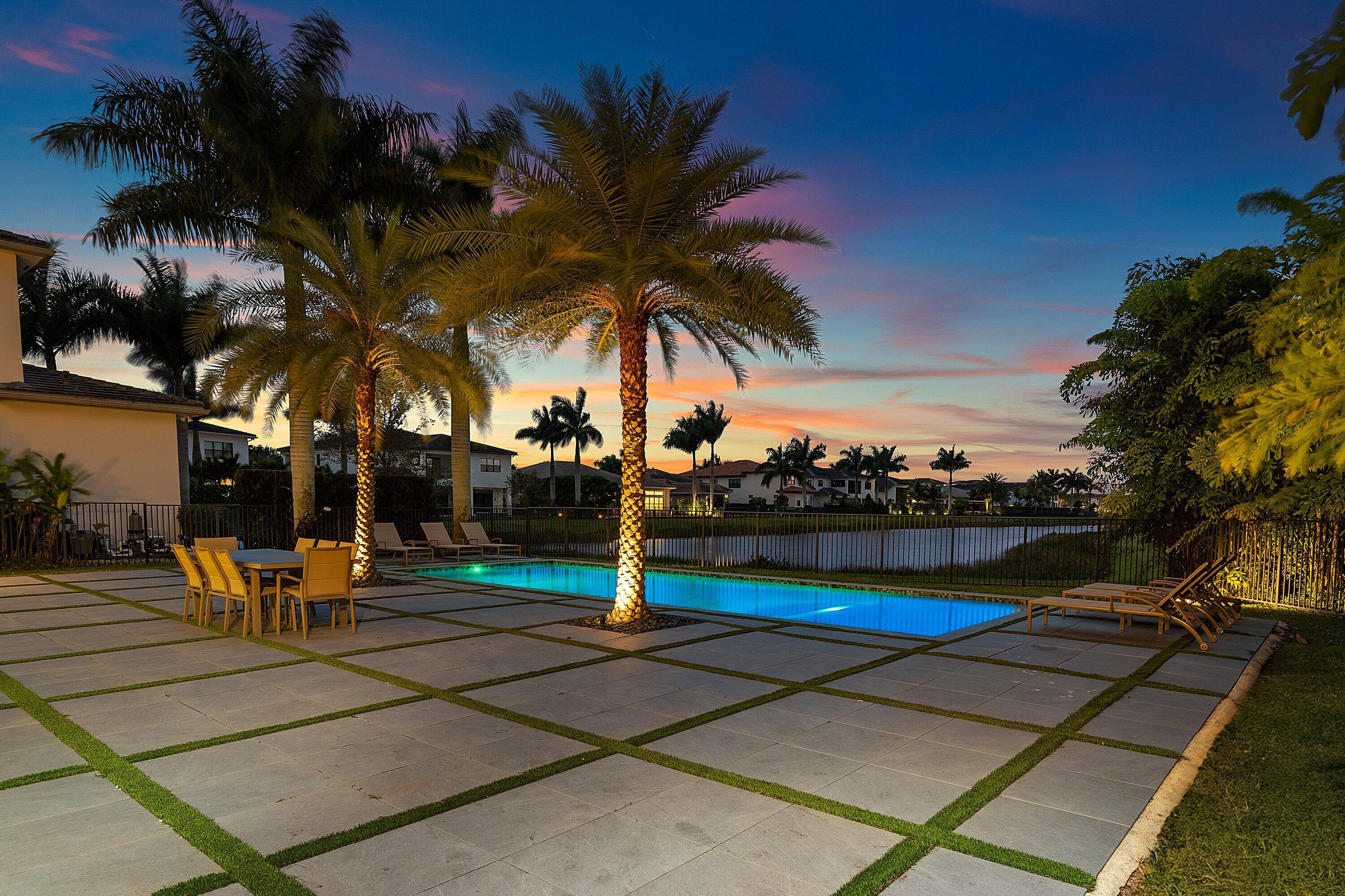 17353 Rosella Road Boca Raton, FL 33496 - Photo 67 of 77 a view of a swimming pool with lounge chair and palm trees