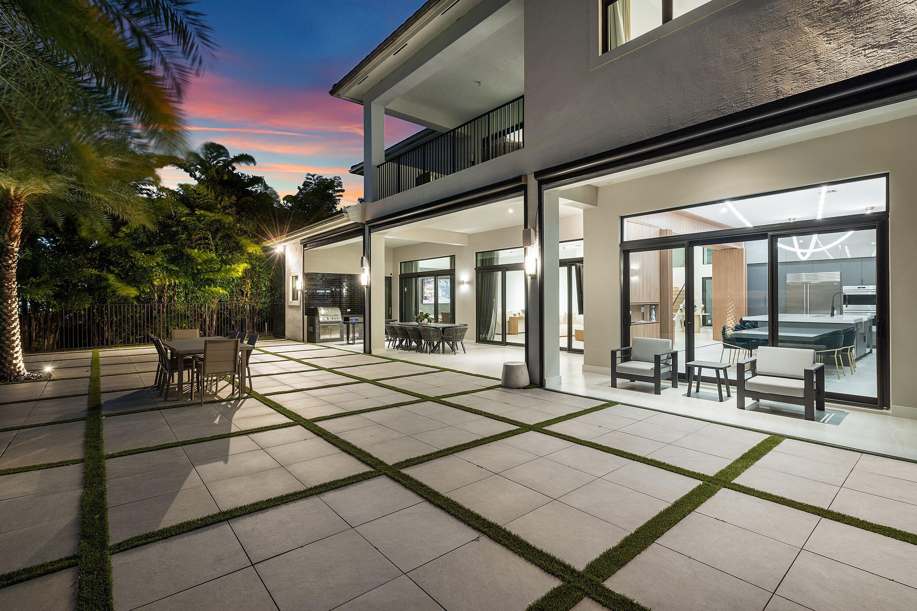 17353 Rosella Road Boca Raton, FL 33496 - Photo 69 of 77 a view of a entryway door with outdoor seating