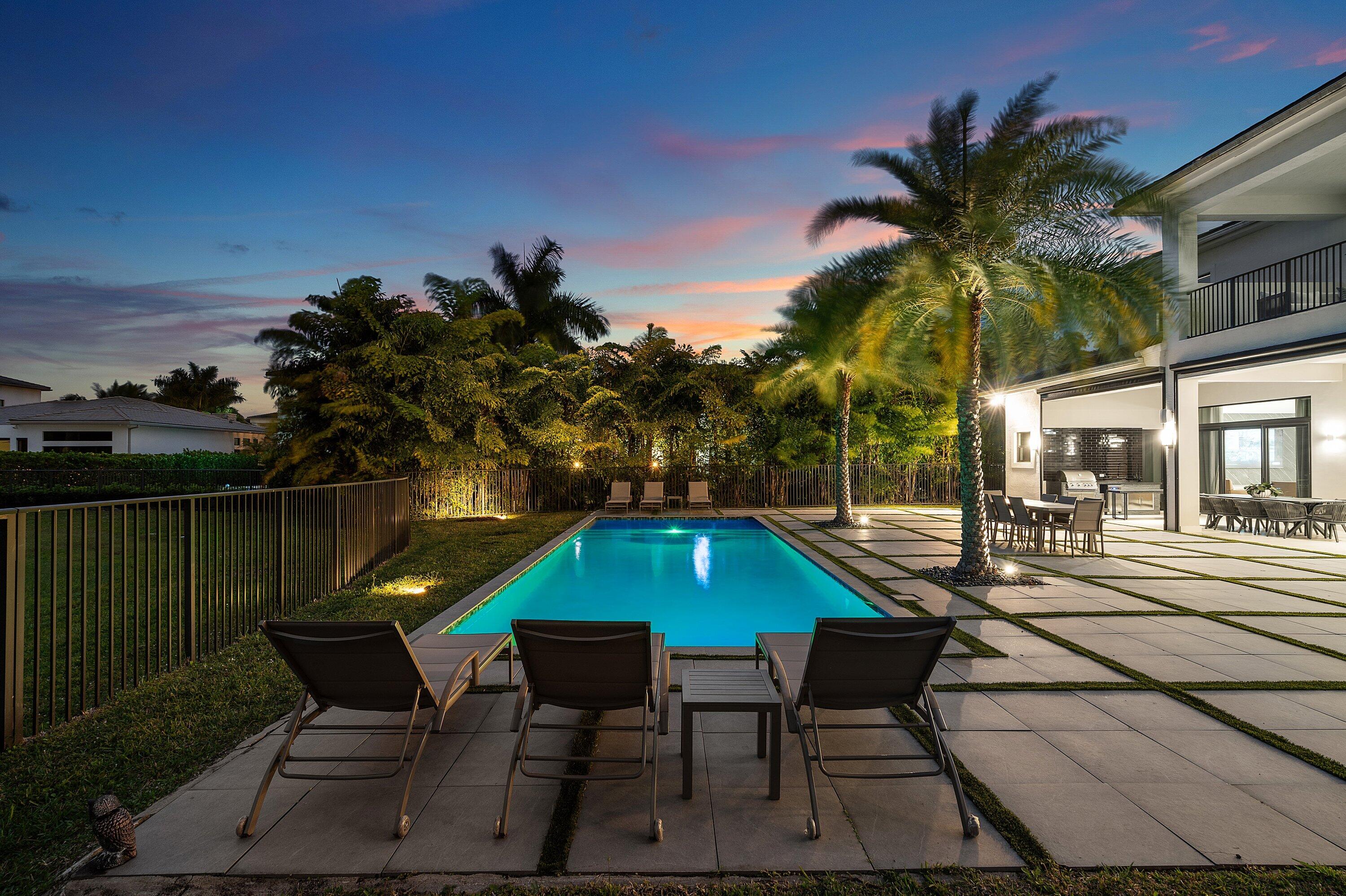 17353 Rosella Road Boca Raton, FL 33496 - Photo 75 of 77 a backyard of a house with table and chairs