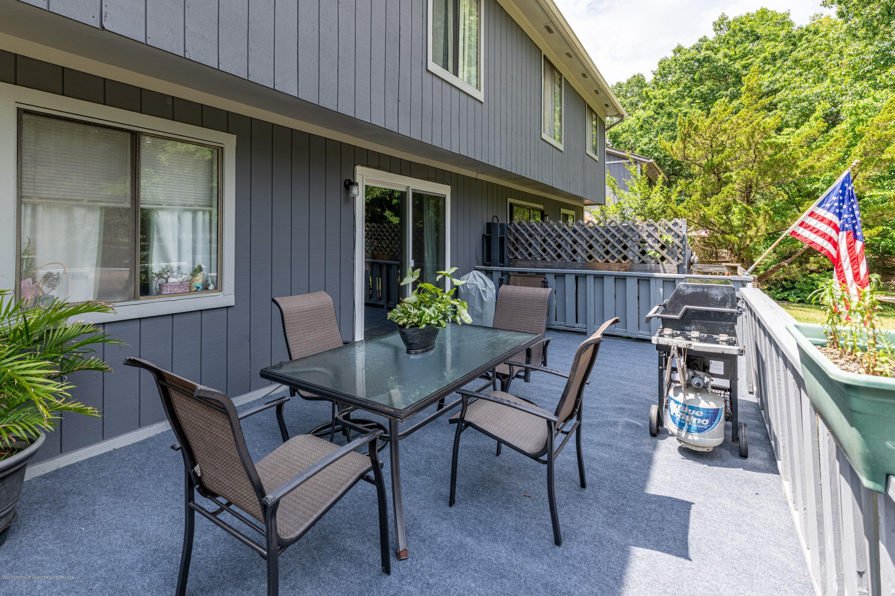 15 Finch Road Howell, NJ 07731 - Photo 2 of 15 a view of a house with backyard and sitting area