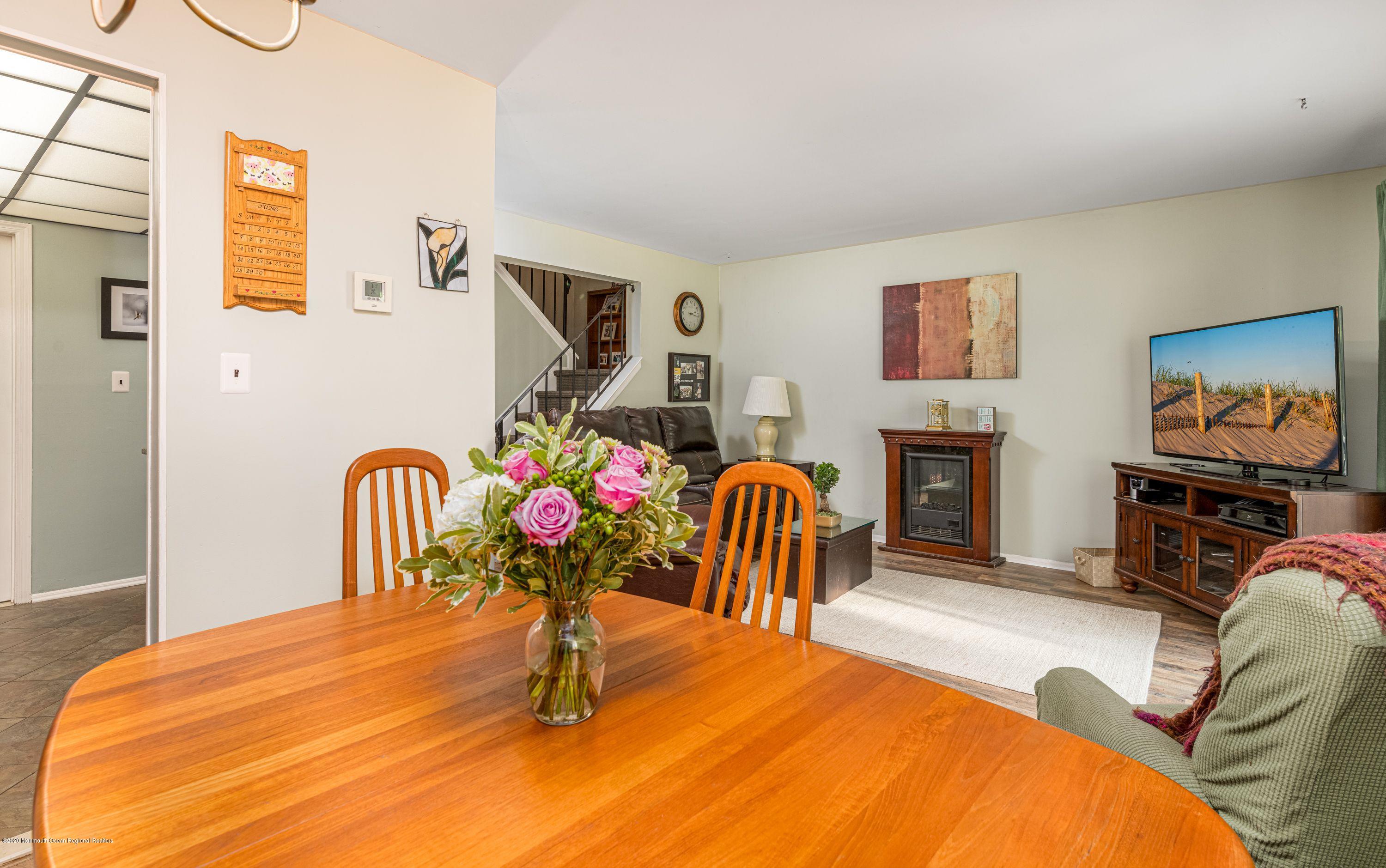 15 Finch Road Howell, NJ 07731 - Photo 6 of 15 a bedroom with furniture and a fireplace