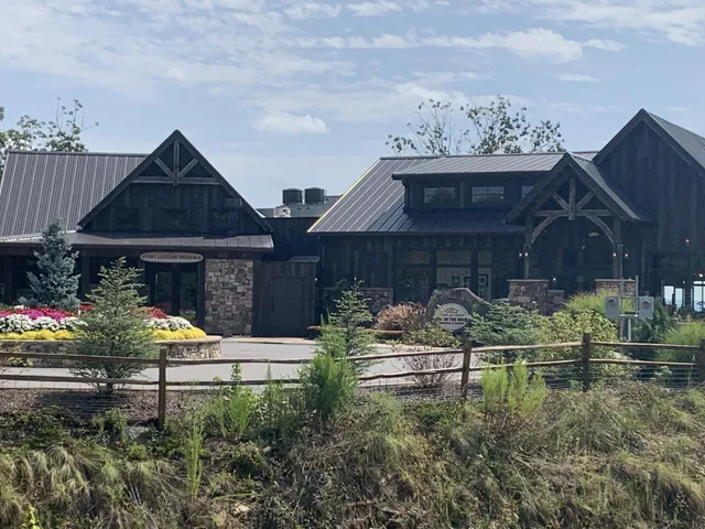 a house with lots of trees in the background
