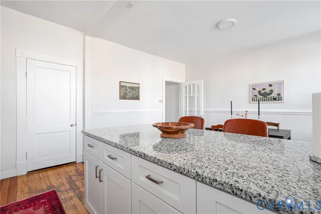 a bathroom with a sink a window and shower