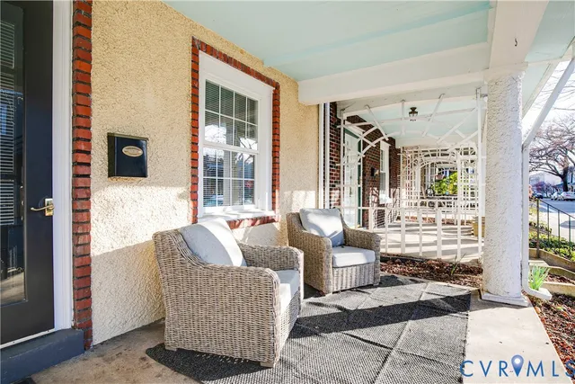 a living room filled with furniture and a window
