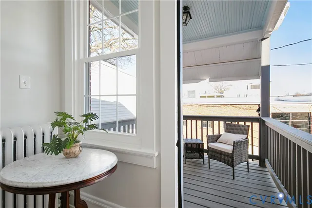 a car parked in front of a white house