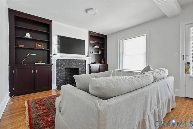 a bedroom with furniture and a flat screen tv