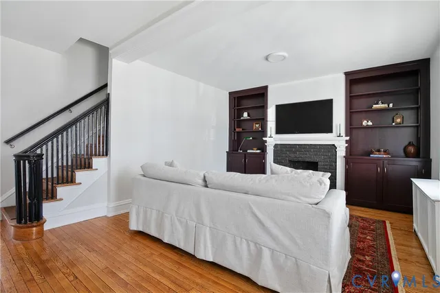 a kitchen with stainless steel appliances granite countertop a stove a sink a dining table and chairs