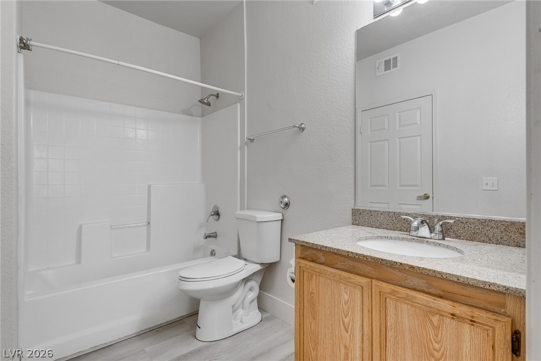 10550 West Alexander Road, Unit 1139 Las Vegas, NV 89129 - Photo 19 of 27 A well-appointed bathroom features a practical tub and shower combination alongside a vanity with ample counter space.