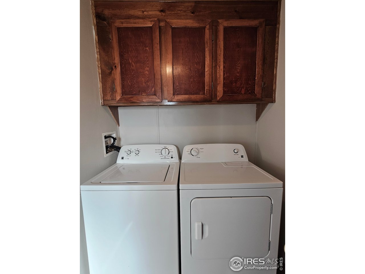 1912 Fillmore Street Sterling, CO 80751 - Photo 14 of 27 Laundry located between the main bathroom and kitchen