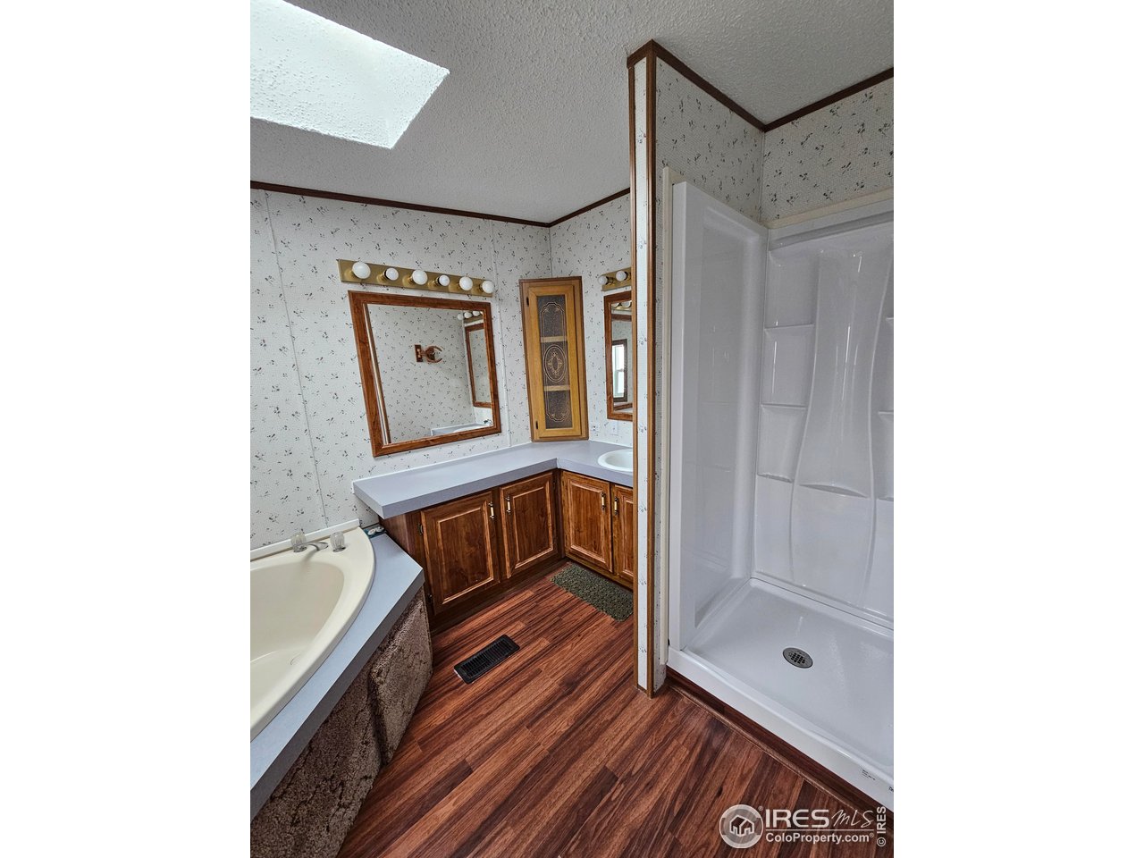 1912 Fillmore Street Sterling, CO 80751 - Photo 18 of 27 Primary bathroom with soaker tub and new shower insert
