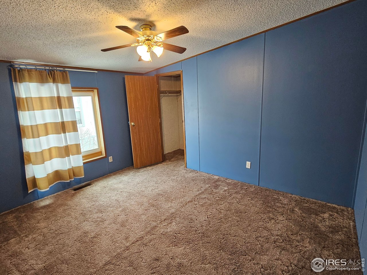 1912 Fillmore Street Sterling, CO 80751 - Photo 21 of 27 3rd bedroom w/ walk-in closet