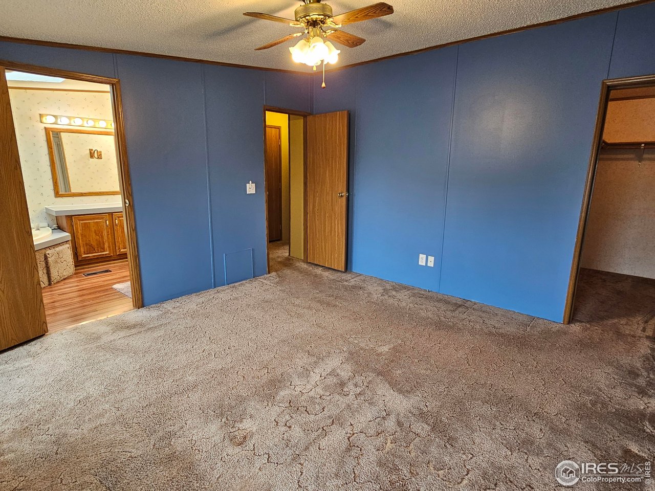 1912 Fillmore Street Sterling, CO 80751 - Photo 3 of 27 Roomy primary w/ ensuite bathroom and walk-in closet