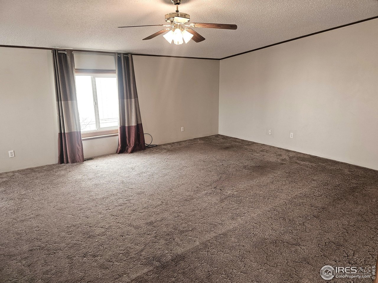 1912 Fillmore Street Sterling, CO 80751 - Photo 8 of 27 Living room is 22 x 15 and has a fresh new coat of paint!