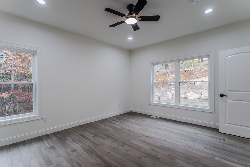 135 Thompson Street Palmer, MA 01069 - Photo 15 of 39 a view of an empty room with wooden floor and a window