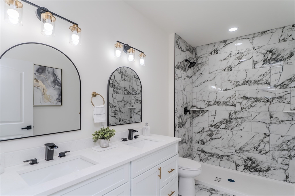 135 Thompson Street Palmer, MA 01069 - Photo 23 of 39 a bathroom with a sink toilet and shower