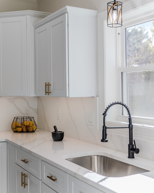 135 Thompson Street Palmer, MA 01069 - Photo 3 of 39 a kitchen with a sink and cabinets