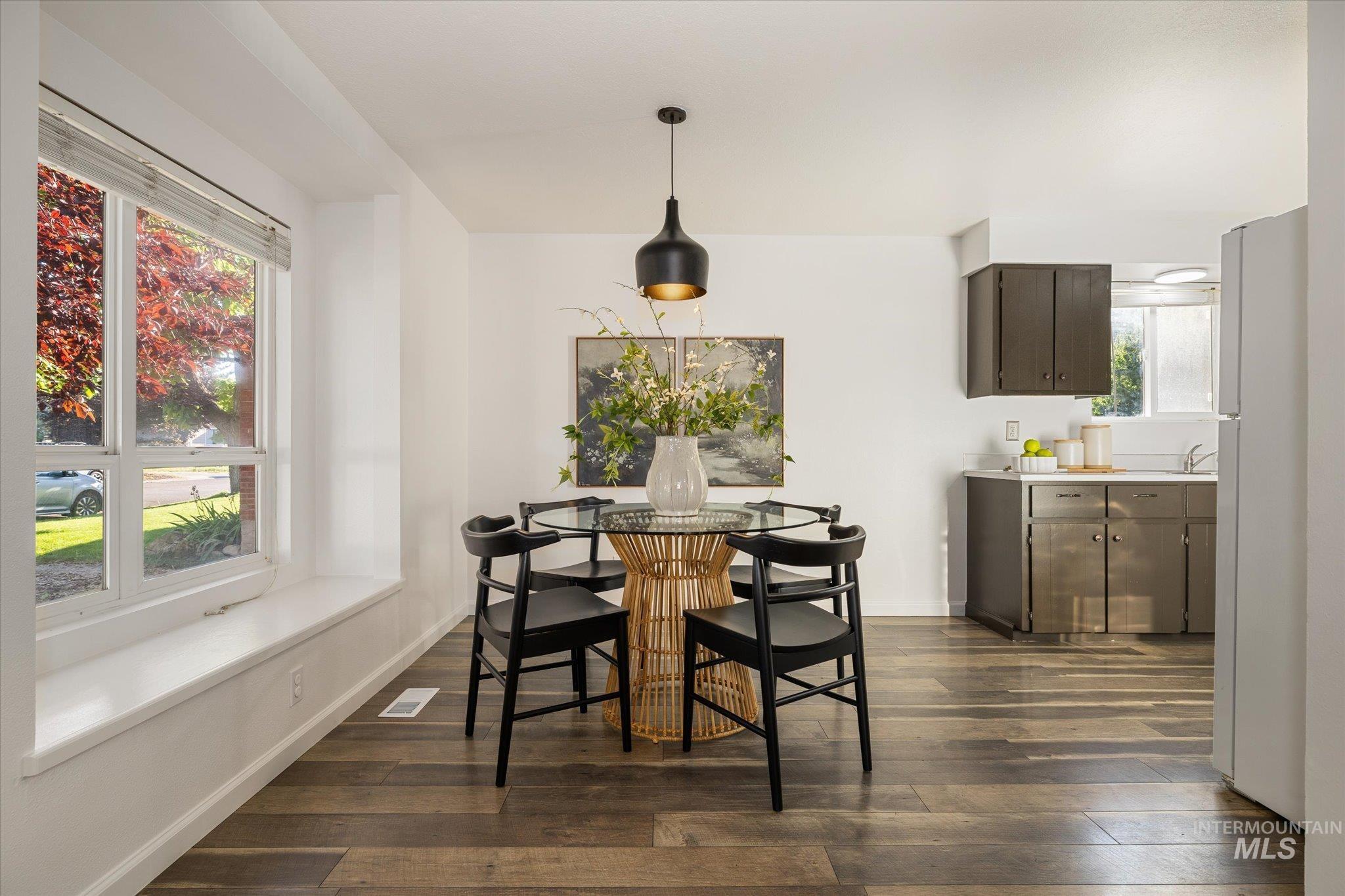 2302 Pendleton Street Boise, ID 83705 - Photo 9 of 35 Bright dining area featuring wood-finish flooring and a contemporary pendant light fixture