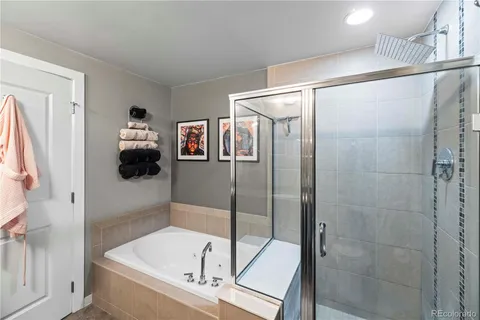 a bathroom with a bathtub and a shower