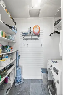 a view of storage and utility room with washer and dryer