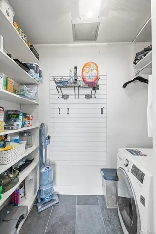 a view of storage and utility room with washer and dryer