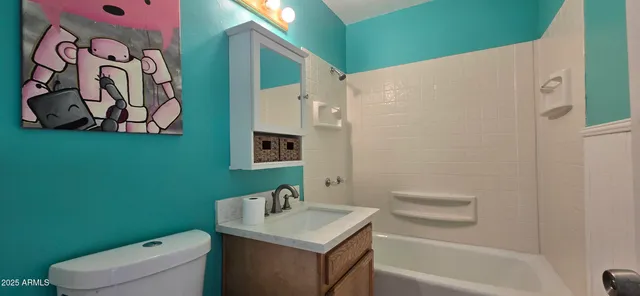 a bathroom with a toilet sink and tub