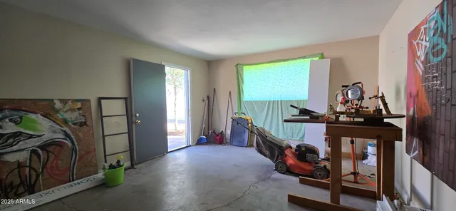 a room with lots of furniture and a window