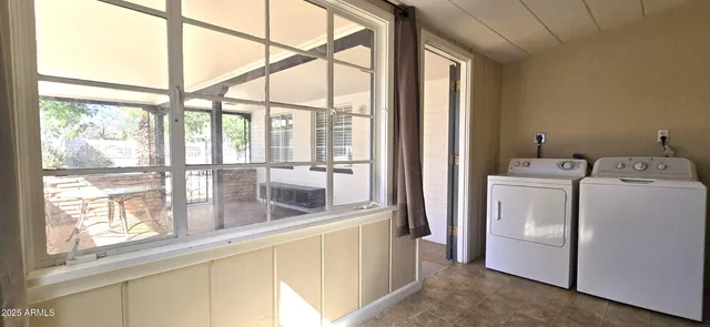 a view of a room with washer and dryer